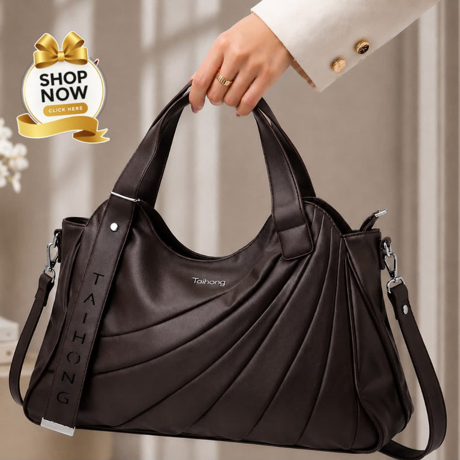 A dark brown faux-leather handbag with draped pleated details