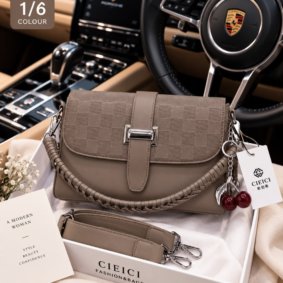 Checkered crossbody bag featuring decorative cherry keychain