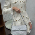 Chic quilted shoulder bag with knot strap and triangle lock for women