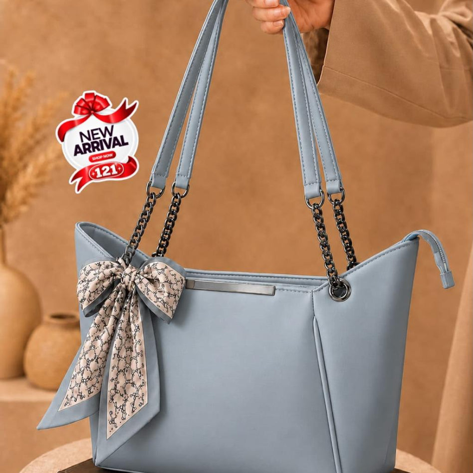 Chic women's tote bag with gold chain shoulder straps