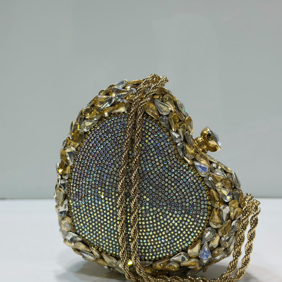 Crystal embellished heart-shaped clutch detailing by Rivaalane