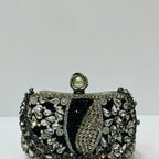 Elegant crystal embellished bridal clutch with pearl clasp
