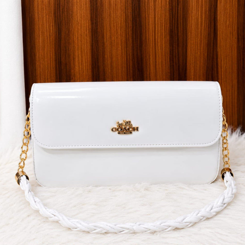Elegant glossy shoulder bag with decorative chain strap