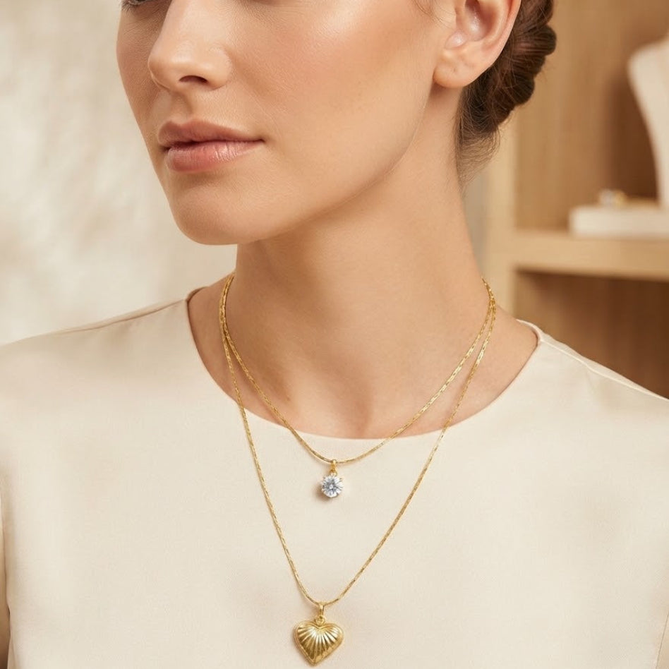 Elegant gold-tone layered charm pendant necklace for women | Rivaalane