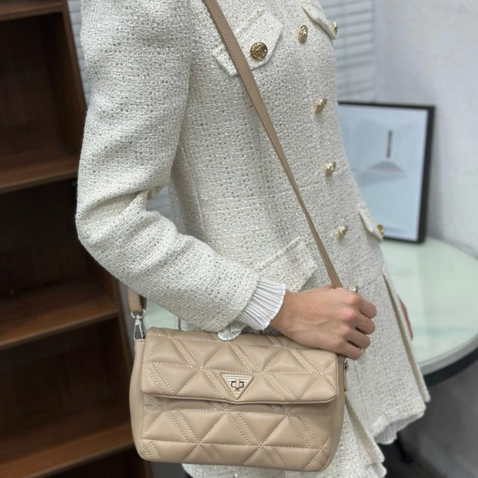 Elegant quilted shoulder bag with triangle lock detail