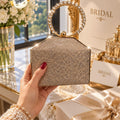 Elegant shimmering hard case clutch with diamond ring handle for women