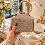 Elegant shimmering hard case clutch with diamond ring handle for women