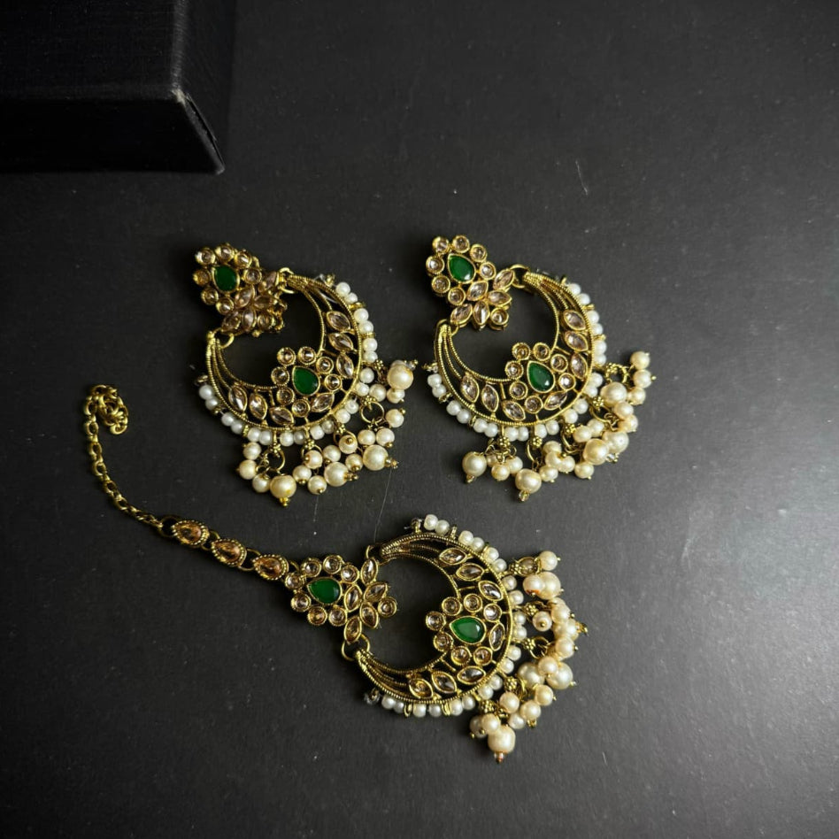 Elegant traditional earrings and maang tikka set by Rivaalane