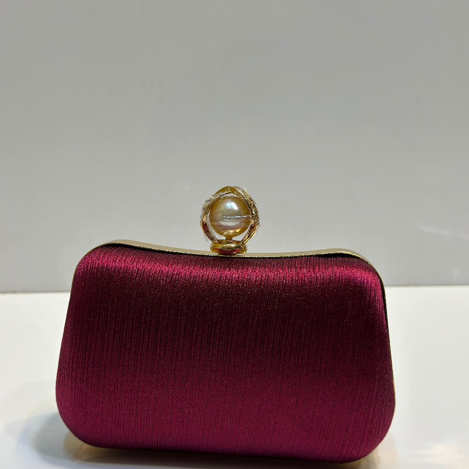 Elegant women's bridal party clutch bag with silk texture and pearl clasp