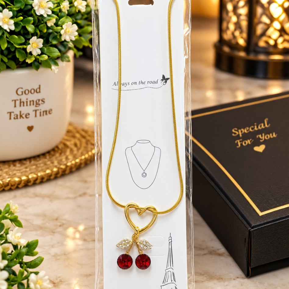 Elegant women's cherry pendant necklace with zirconia heart detail by Rivaalane