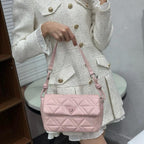Elegant women's handbag with knot strap and triangle lock