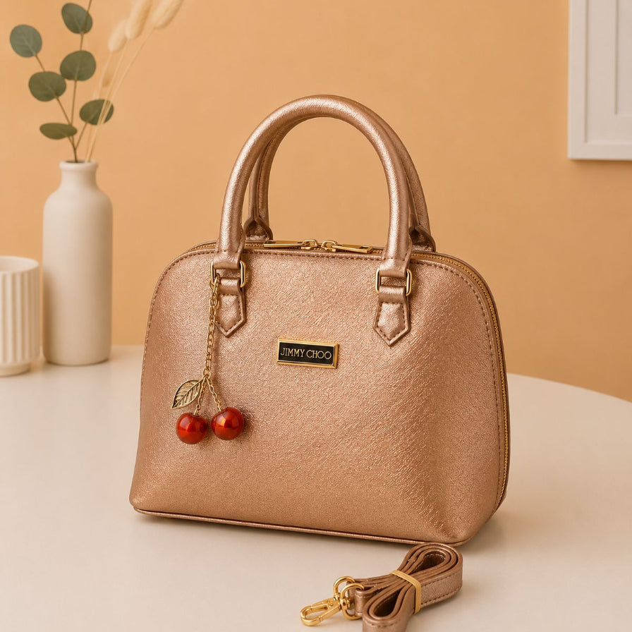 Golden metallic top handle crossbody handbag