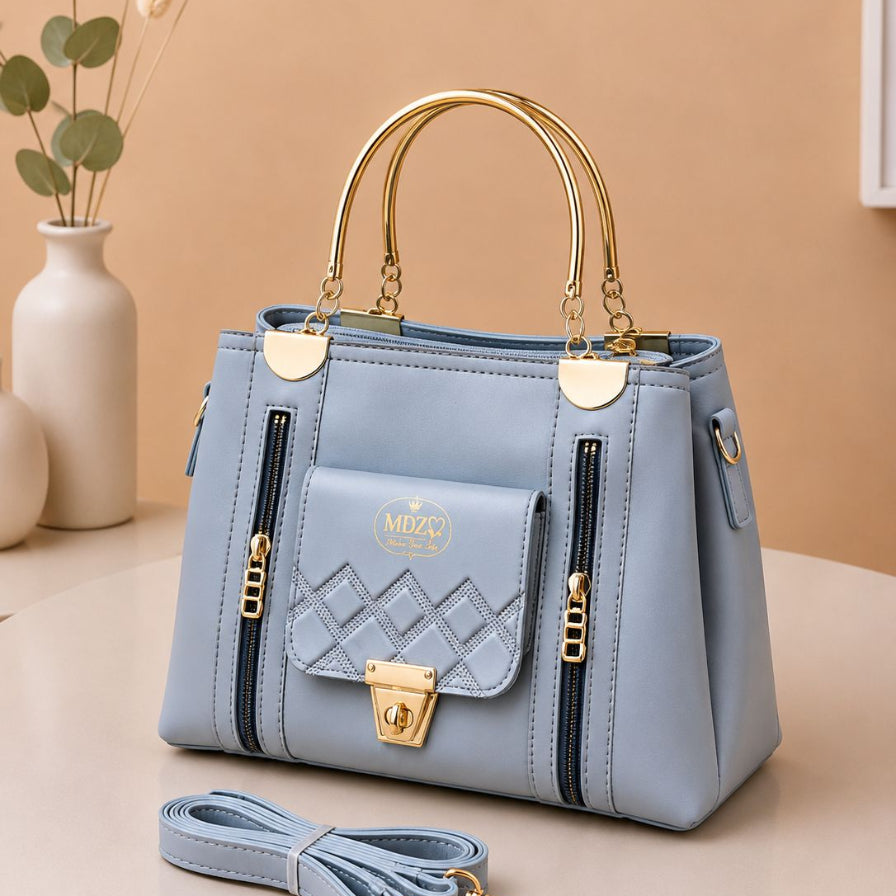 Fashionable structured satchel with long shoulder strap