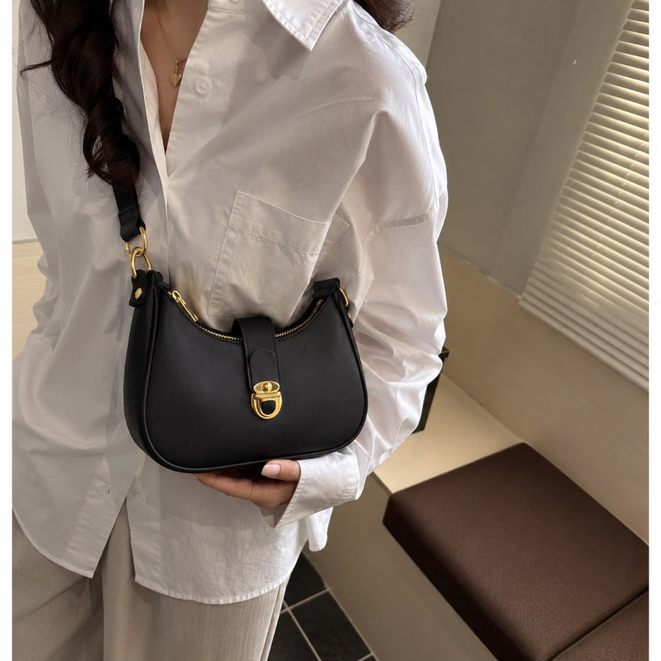 Fashionable women's handbag with front lock