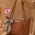 Fashionable women's handbag with scarf and chain straps