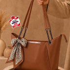 Fashionable women's handbag with scarf and chain straps