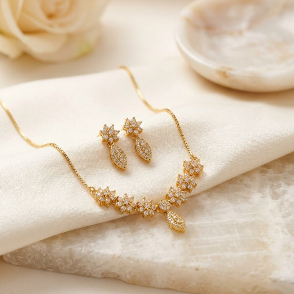 Floral-inspired zirconia necklace with matching earrings by Rivaalane