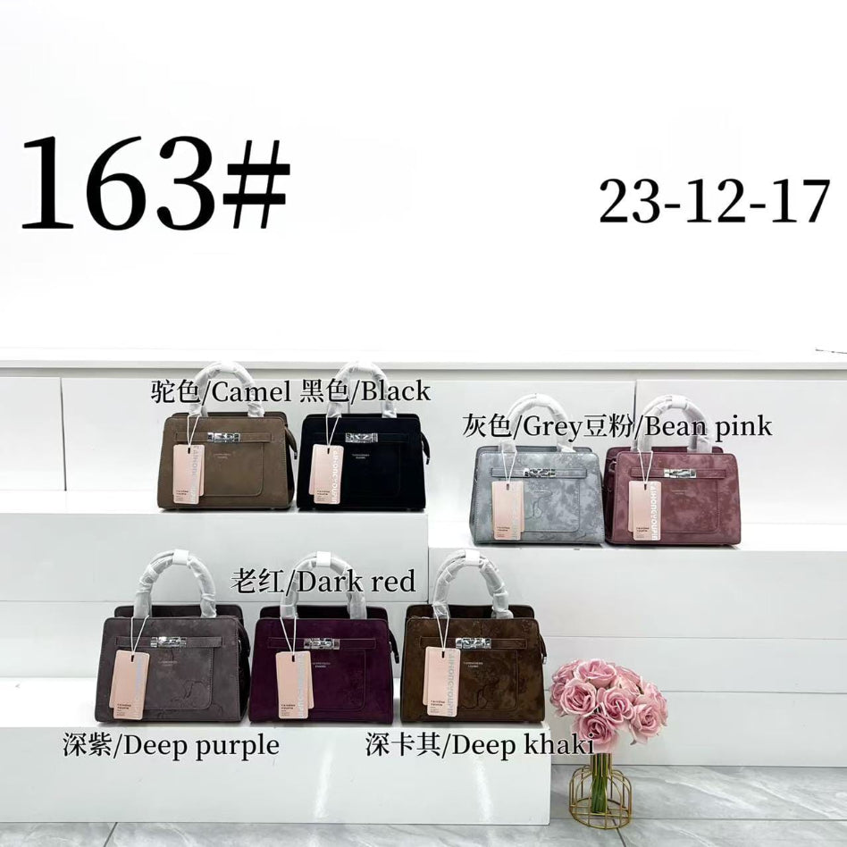 Floral fashion handbag photographed against a neutral background