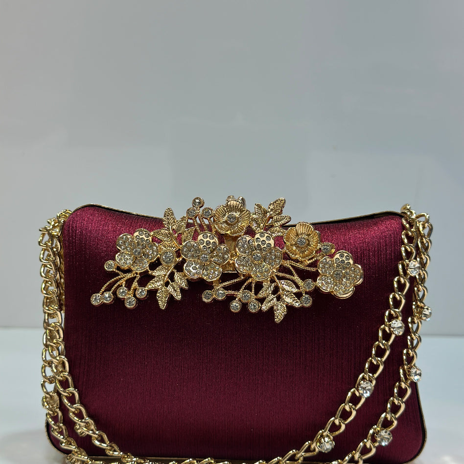 Front view of the Rivaalane rhinestone flower clasp clutch