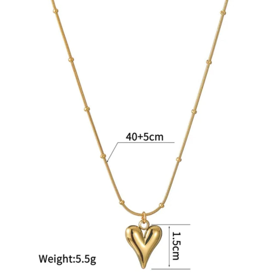 Gold heart pendant necklace with a beaded chain