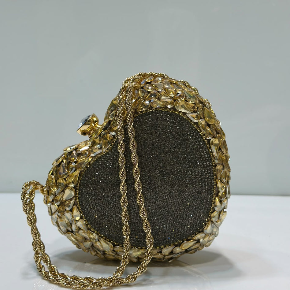 Heart-shaped party clutch with sparkling crystal detailing and chain strap