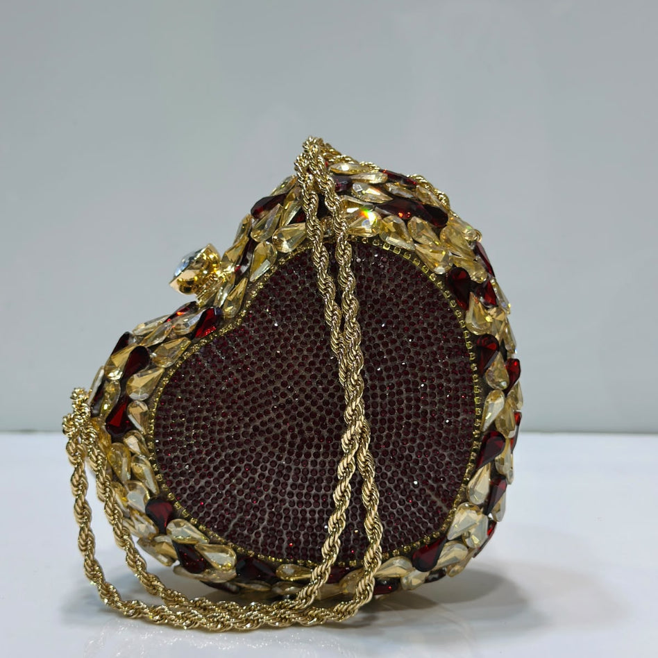 Luxury crystal embellished heart-shaped party clutch with chain strap by Rivaalane