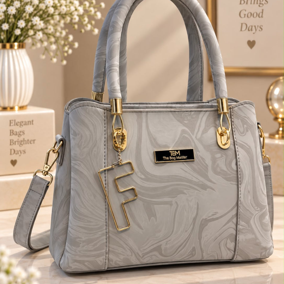 Marbled pattern satchel bag with letter charm and gold hardware