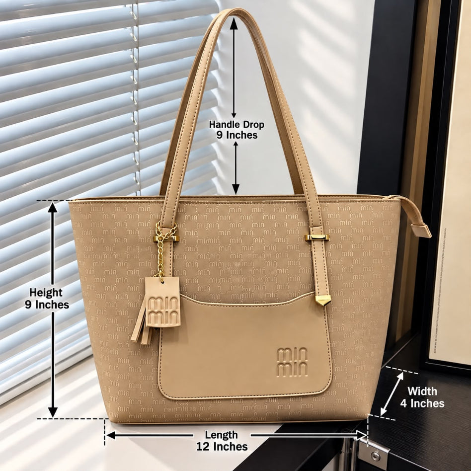 Monogram pattern tote bag with front pocket and tassel charm