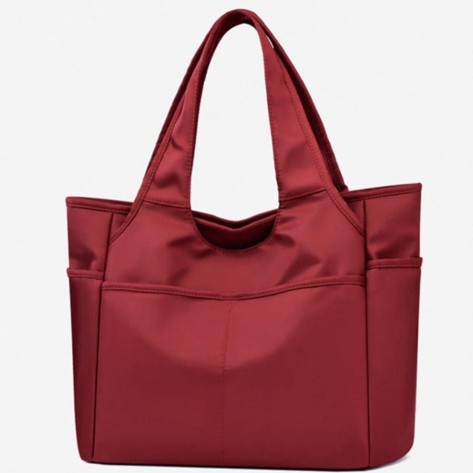 Multi-pocket handbag with roomy interior design