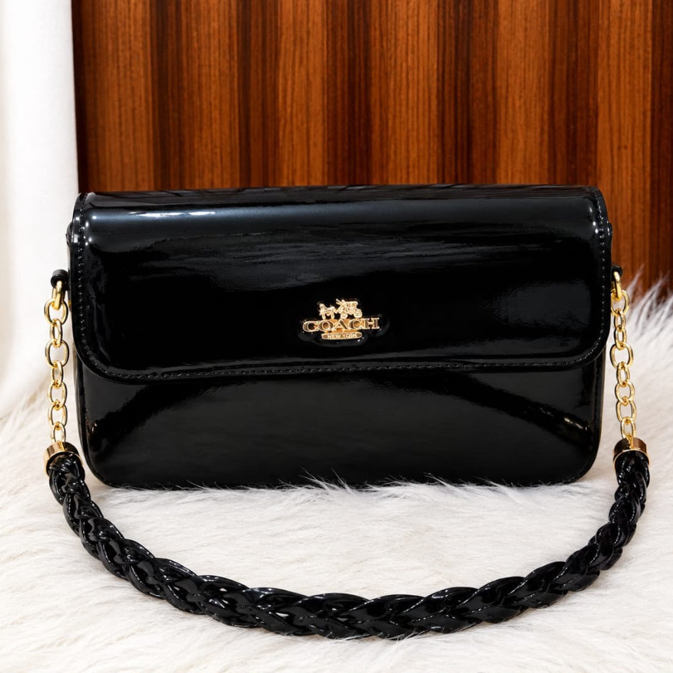 Patent finish shoulder handbag with braided chain strap
