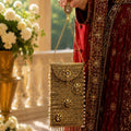 Regal antique gold stone-embellished mobile clutch for women by Rivaalane