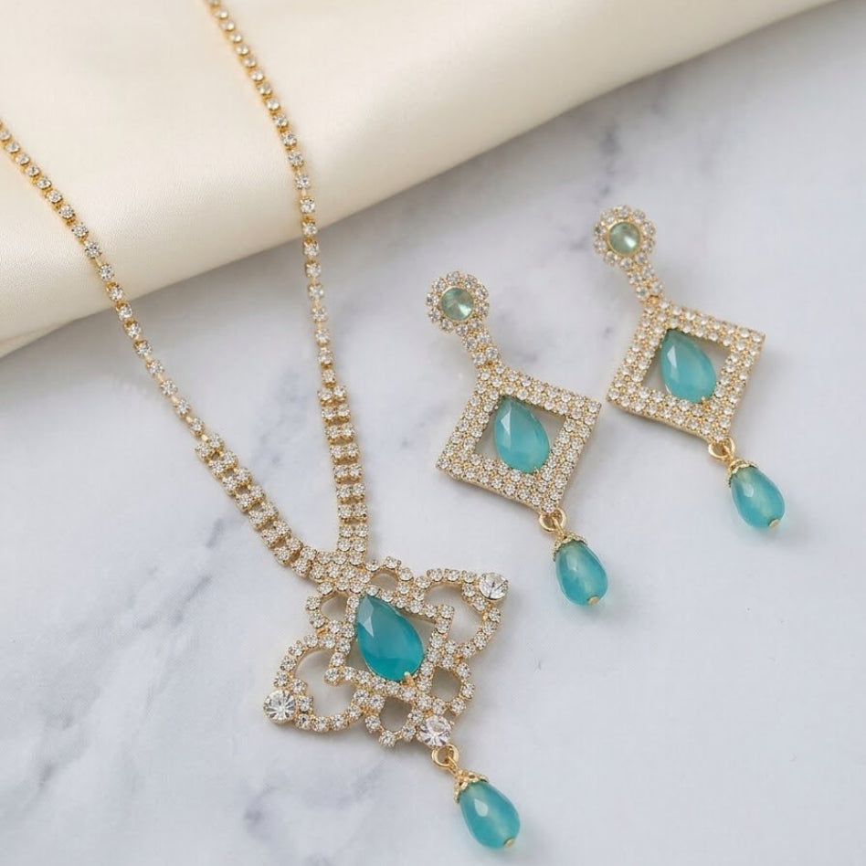 Rivaalane crystal embellished pendant necklace and matching earrings set