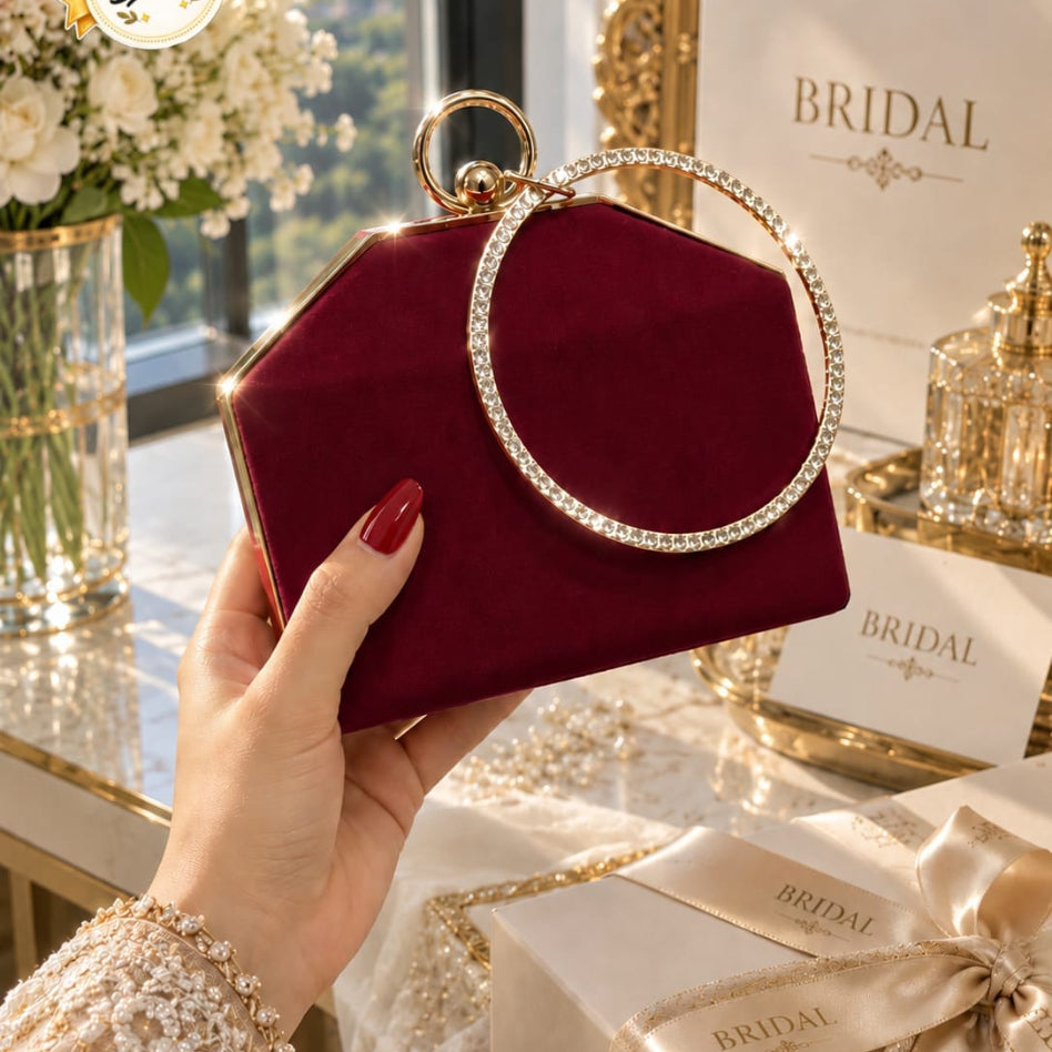 Shimmering wristlet purse with diamond ring style handle