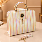 Structured fashion handbag with decorative tassel charm