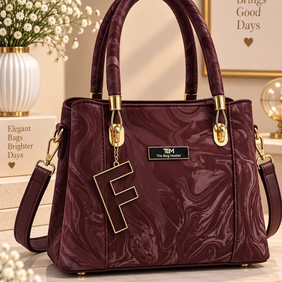 Stylish satchel bag with decorative letter charm
