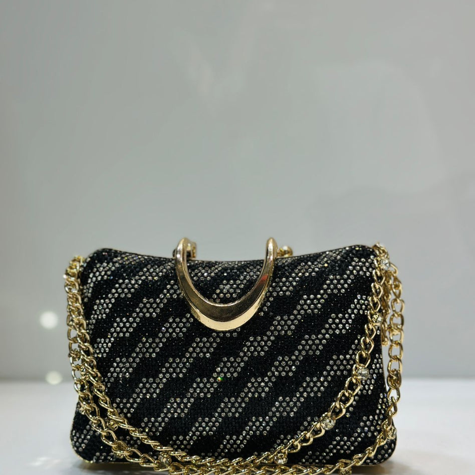 Stylish sparkling rhinestone evening crossbody bag and clutch purse with curved gold handle.