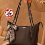 Stylish structured handbag with decorative bow
