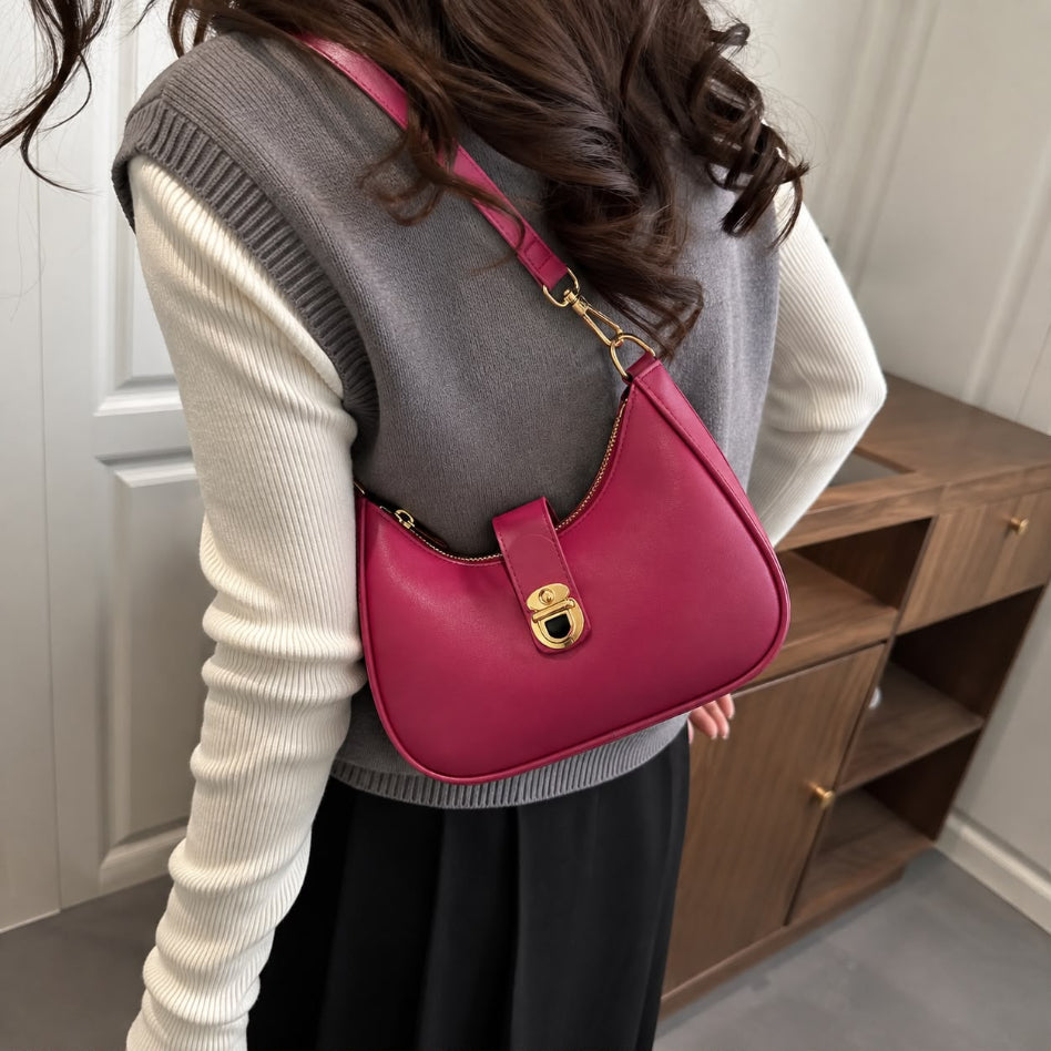 Women's curved shoulder bag with gold hardware