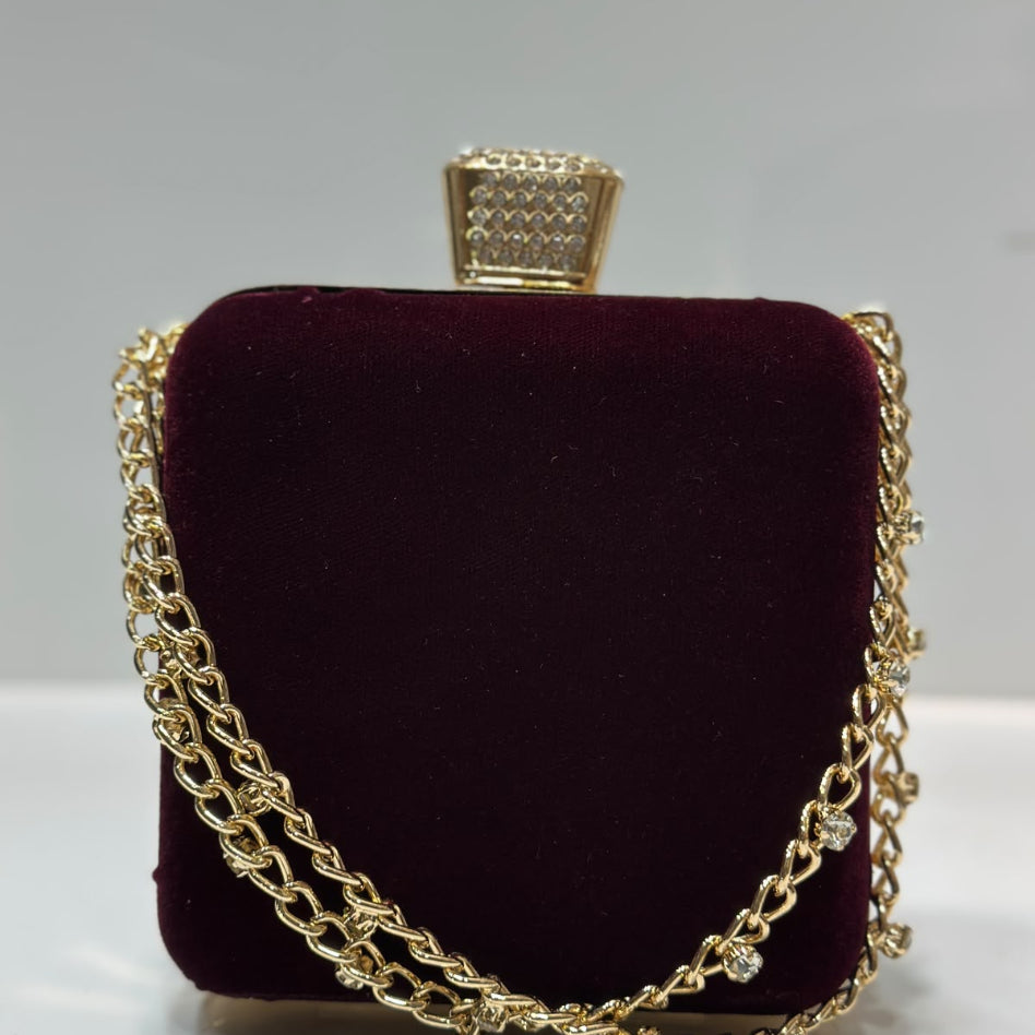 Women's glitter party clutch featuring a decorative crystal clasp
