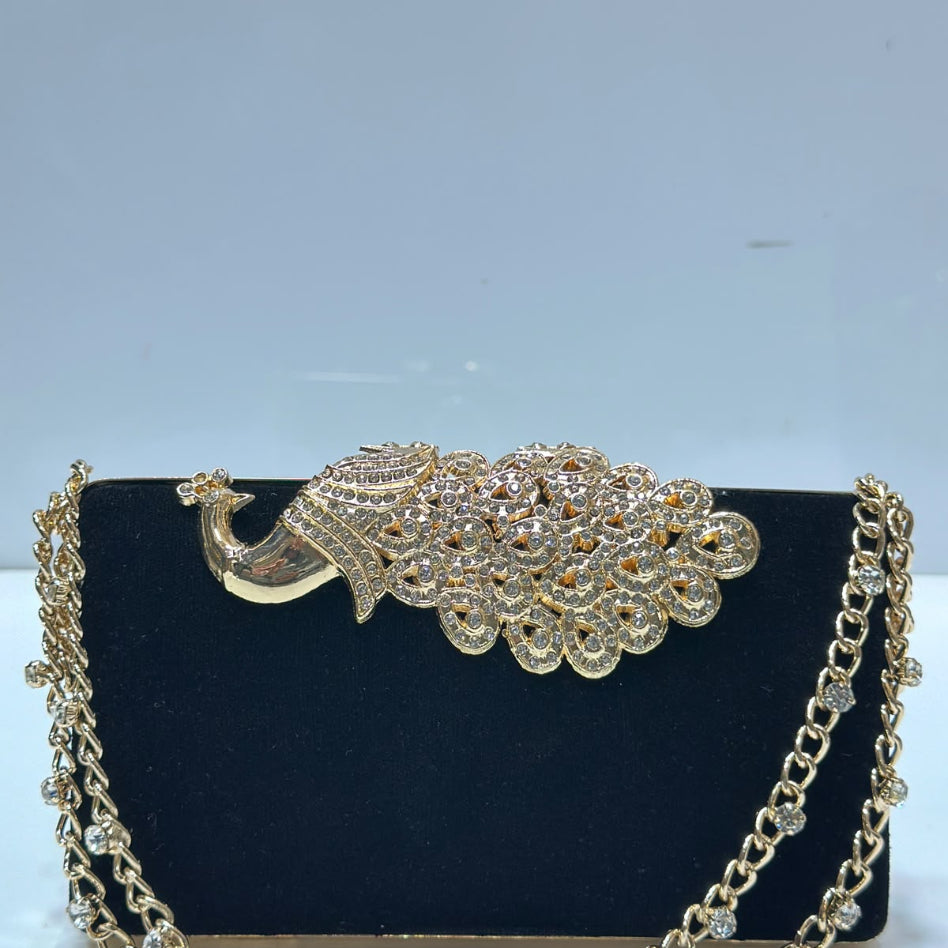 Women's hard case evening clutch featuring a decorative peacock motif