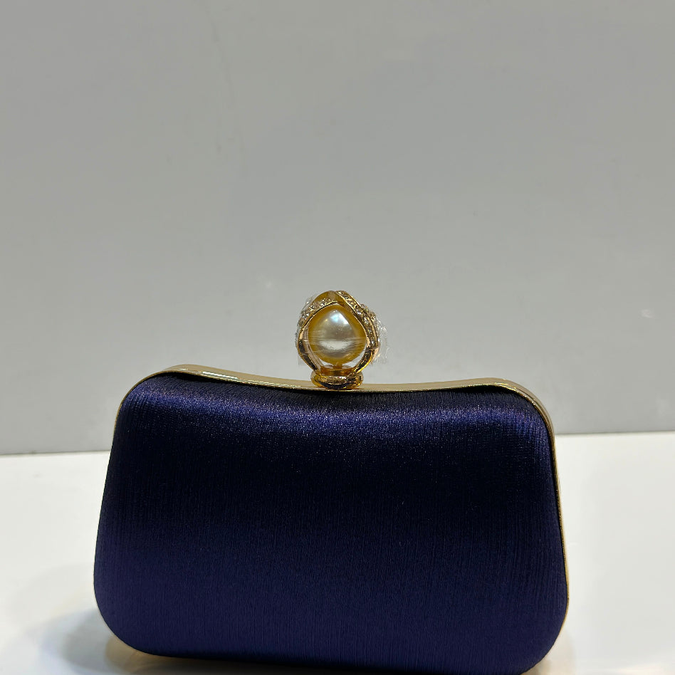 Women's hard case party clutch with pearl top lock
