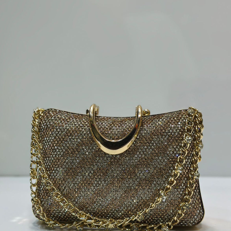 Women's luxury crystal clutch purse with gold hardware and chain strap.