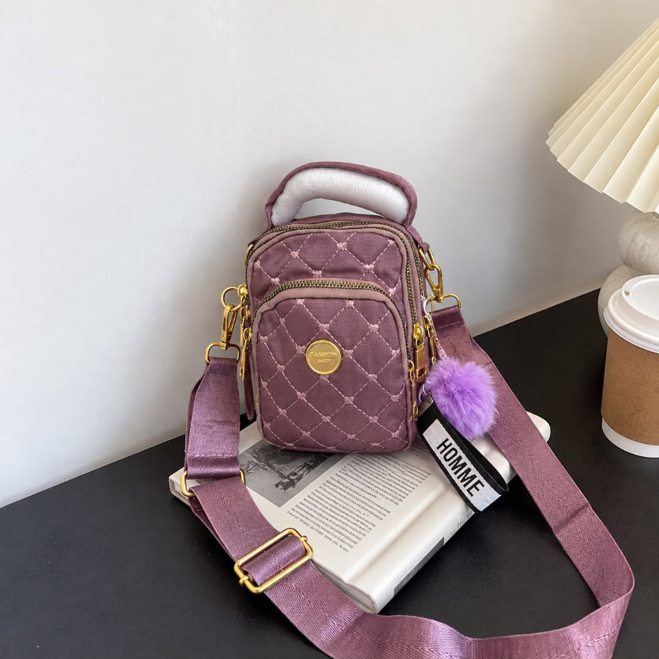 Women's quilted backpack with gold-tone hardware