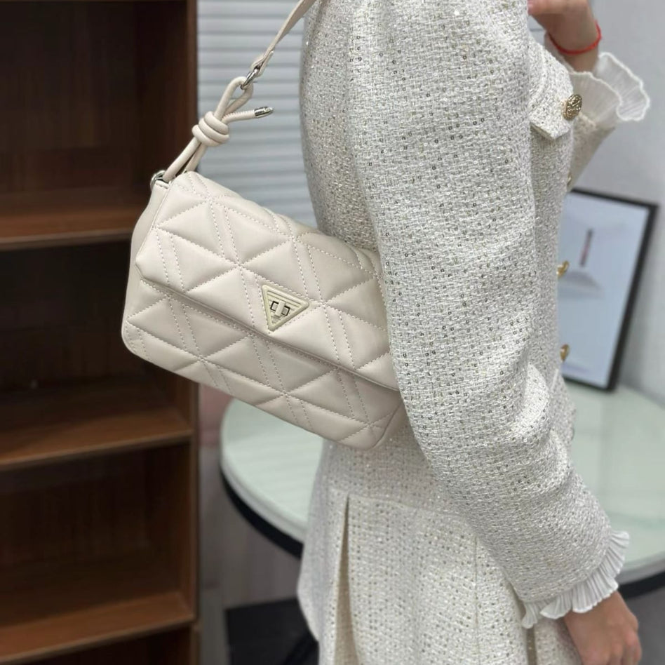 Women's quilted handbag with stylish knot-detail strap