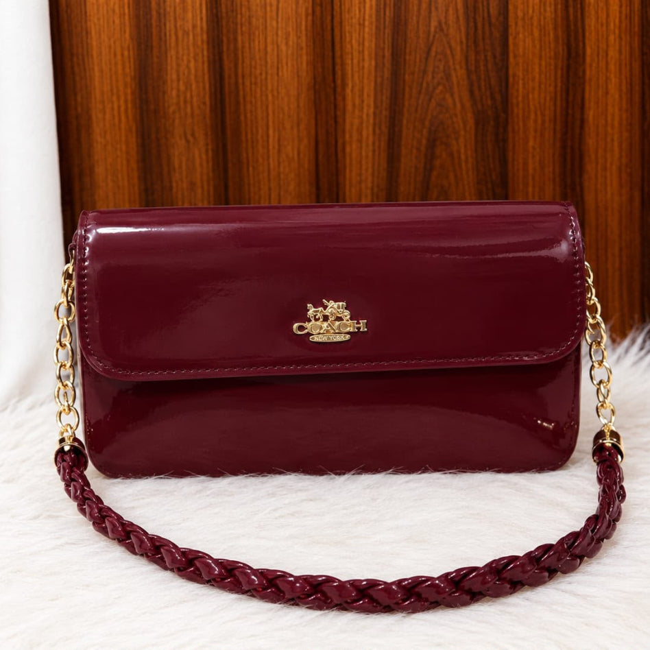 Women's shoulder bag featuring a polished glossy surface