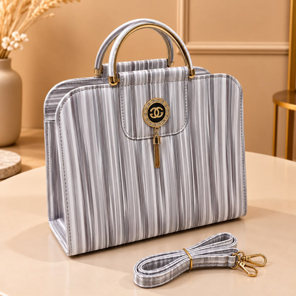 Women's striped handbag with elegant gold-tone hardware