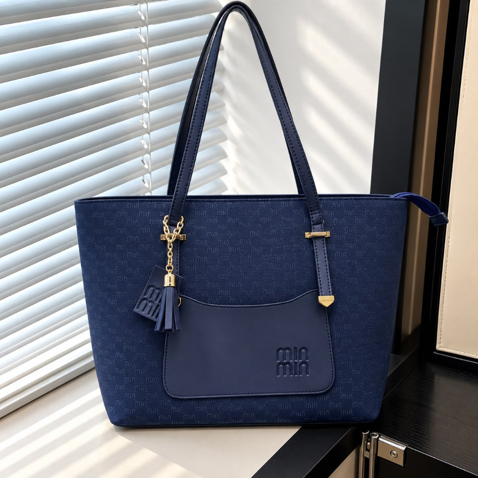 Women's tote bag with tassel charm detail