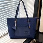 Women's tote bag with tassel charm detail