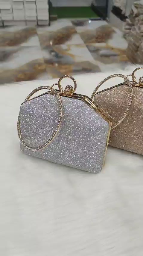 Bridal evening purse with sparkling finish and statement ring handle