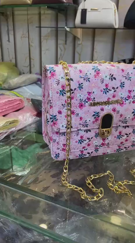 Stylish women's shoulder bag with gold chain hardware